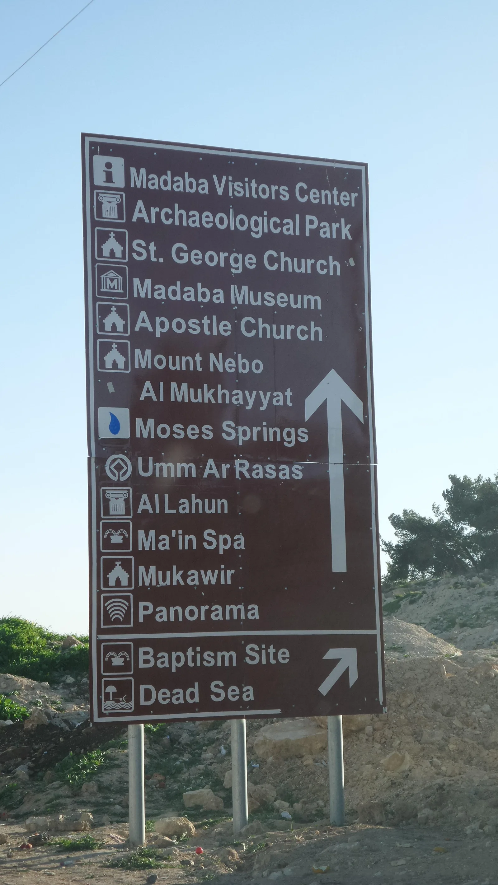 A Jordanian road sign listing Madaba, Mount Nebo, the Baptism Site and the Dead Sea